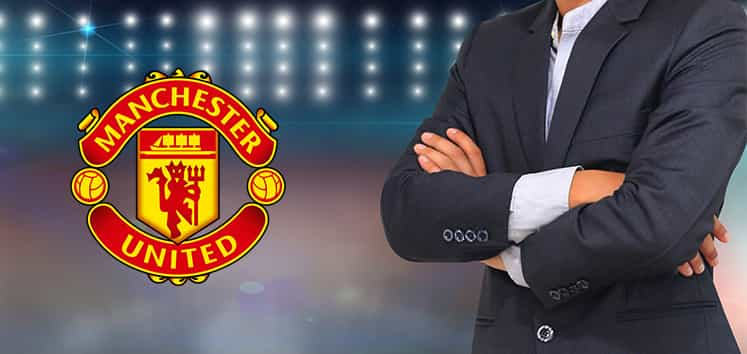 Man in a suite and the Manchester United logo