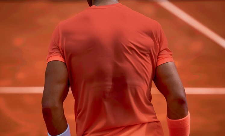 Rafa Nadal's back muscles through his sweaty shirt