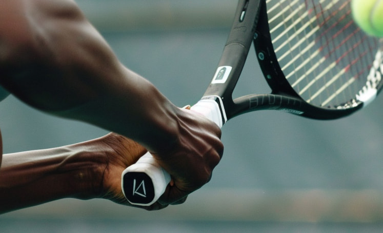 Serena William's holding a tennis raquet close up shot