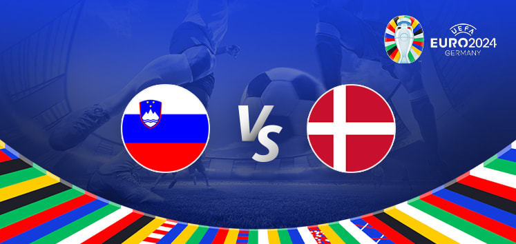 The image depicts a graphic for the Euro 2024 football match between Slovenia and Denmark. It features the national flags of Slovenia and Denmark positioned on either side of the letters "Vs" at the centre. In the background, there is a blurred stadium scene with a football at a player's feet, emphasizing the competitive nature of the match. The top right corner displays the Euro 2024 logo with the tournament name and location, "Germany." The bottom of the image is bordered by a colourful array of national flags from various countries, adding a vibrant and festive touch.