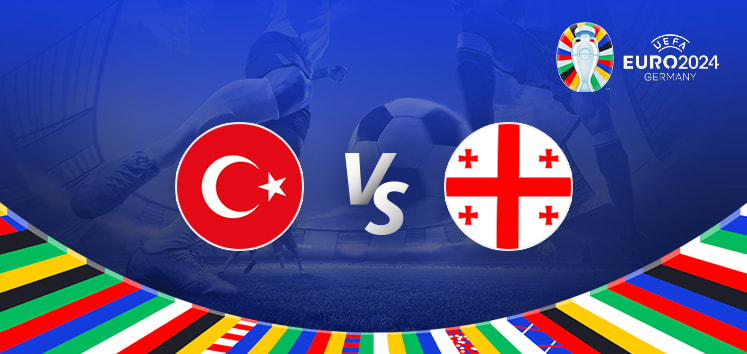 The image is a promotional graphic for the Euro 2024 football match between Turkey and Georgia. It features the national flags of Turkey (a red flag with a white star and crescent) and Georgia (a white flag with a red cross and four smaller red crosses) positioned on either side of the letters "Vs" in the centre. The background shows a football stadium under bright lights, with a close-up of a player's leg and a football in the centre. The top right corner displays the Euro 2024 logo along with the tournament name and location, "Germany." The bottom edge is adorned with a colourful border featuring various national flags.