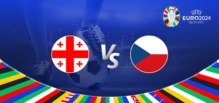 The image is a promotional graphic for the Euro 2024 football match between Georgia and the Czech Republic. It features the national flags of Georgia (a white background with five red crosses) and the Czech Republic (a flag with white, red, and blue colours). The flags are positioned on either side of a large "Vs" in the centre. The background depicts a football stadium under bright lights, with a close-up of a player's leg and a football at the bottom. The top right corner displays the Euro 2024 logo along with the tournament name and location, "Germany." The bottom edge is adorned with a colourful border featuring various national flags.