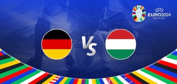 The image is a promotional graphic for the Euro 2024 football match between Germany and Hungary. It features the national flags of Germany (a black, red, and gold flag) and Hungary (a red, white, and green flag) positioned on either side of the letters "Vs" in the centre. The background shows a football stadium under bright lights, with a close-up of a player's leg and a football on the left side. The top right corner displays the Euro 2024 logo along with the tournament name and location, "Germany." The bottom edge is adorned with a colourful border featuring various national flags.