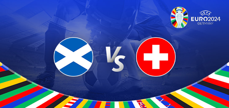 The image is a promotional graphic for the Euro 2024 football match between Scotland and Switzerland. It features the national flags of Scotland (a blue flag with a white diagonal cross) and Switzerland (a red flag with a white cross) positioned on either side of the letters "Vs" in the centre. The background depicts a football stadium under bright lights, with a close-up of a player's leg and a football in the middle. The top right corner displays the Euro 2024 logo along with the tournament name and location, "Germany." The bottom edge is adorned with a colourful border featuring various national flags.