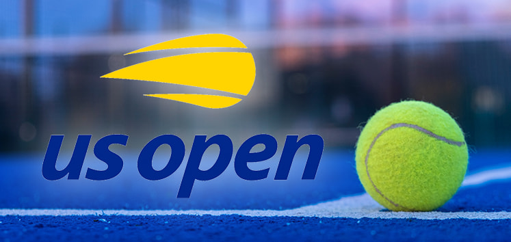 US Open tennis logo with a yellow tennis ball on a blue court, with a blurred background.