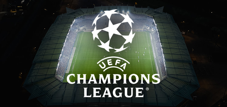 UEFA Champions League logo displayed over a floodlit football stadium during a night match, showcasing the excitement and atmosphere of European football.