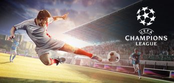 A football player in a white and red kit is mid-air, about to strike the ball on a stadium field during a UEFA Champions League match, with the Champions League logo on the right.