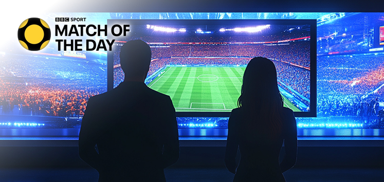 Silhouettes of two presenters watching a football match on a large screen, with the BBC Sport Match of the Day logo.