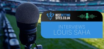 Image of a microphone set up near the sidelines of a football stadium with the BestBettingSites.co.uk logo and the text "Interviews Louis Saha" overlaid, indicating an interview with the former footballer.