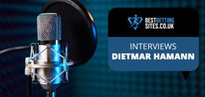 Image featuring a professional microphone setup against a blue acoustic background, accompanied by the text "Interviews Dietmar Hamann" and the BestBettingSites.co.uk logo.