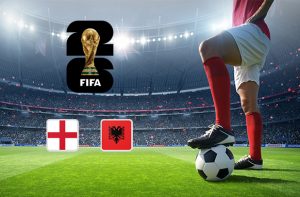 An image showing a football player poised with a ball on a pitch, set against a large stadium backdrop. The FIFA World Cup 2026 logo is prominently displayed above, with the national flags of England and Albania placed below, indicating an upcoming match between the two teams.