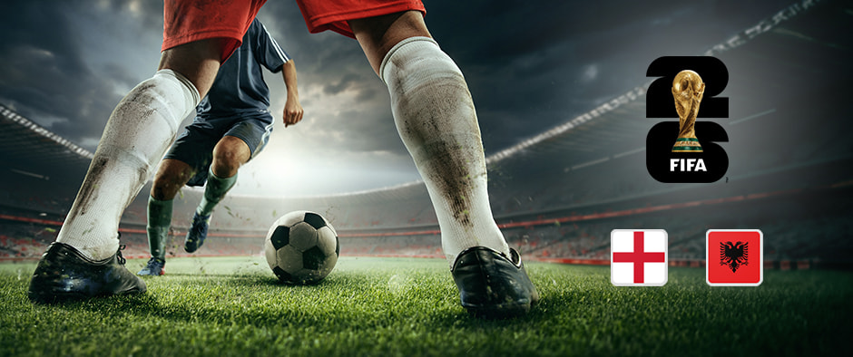 An image showing a close-up of two football players in action on the pitch, with one preparing to kick the ball. The FIFA World Cup 2026 logo is prominently displayed above, alongside the national flags of England and Albania, set against a dramatic stadium backdrop under moody lighting.